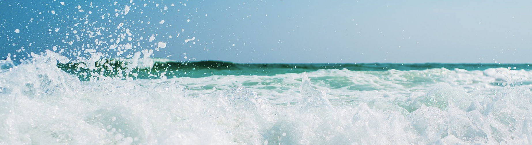 a banner showing an ocean with a wave appearing to crash against the screen